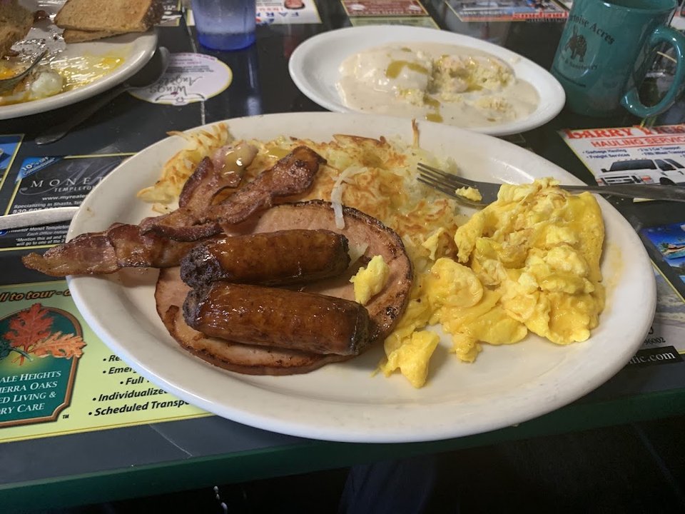 Breakfast menu with omelets and steak.