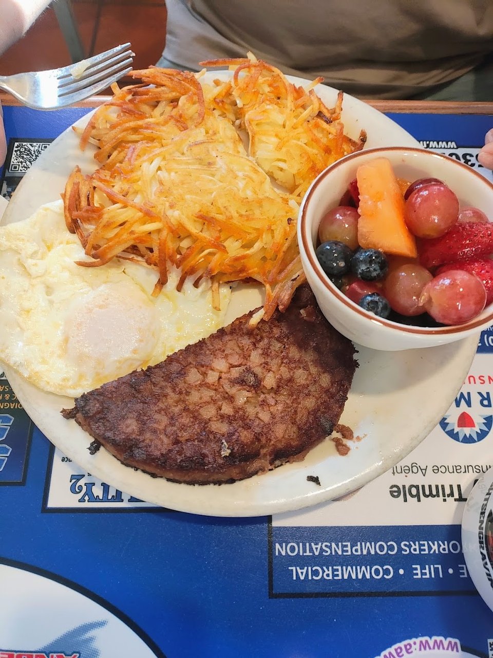 Breakfast menu with omelets and steak.